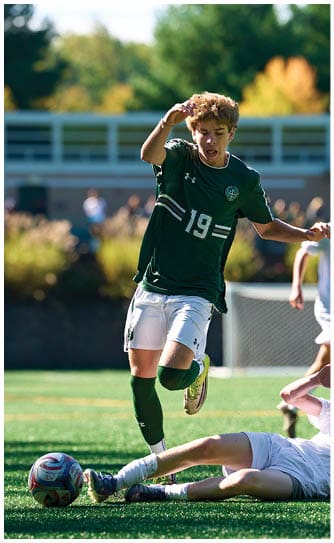 A football player catching a ball. Description generated by AI