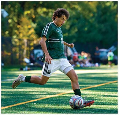 A football game is taking place with a group of men on the field. Description generated by AI