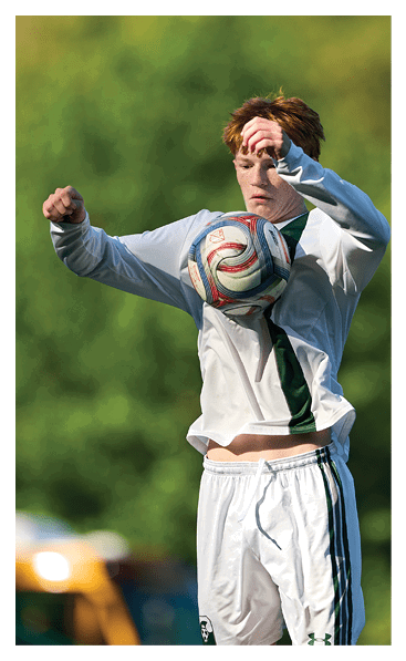 A football player wearing a black and white uniform with the number 10 on the back. AI generated content