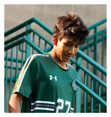 A football player in a white jersey with the number 85 on it is trying to catch a football. AI generated content
