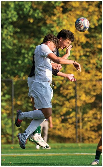 A football player catching a ball. Description generated by AI