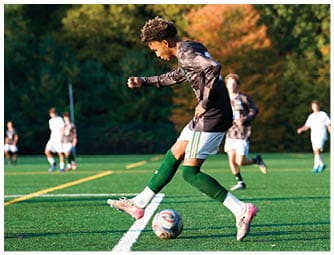 A group of football players on a field. Description generated by AI