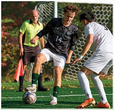 A football game is taking place with a group of men on the field. Description generated by AI