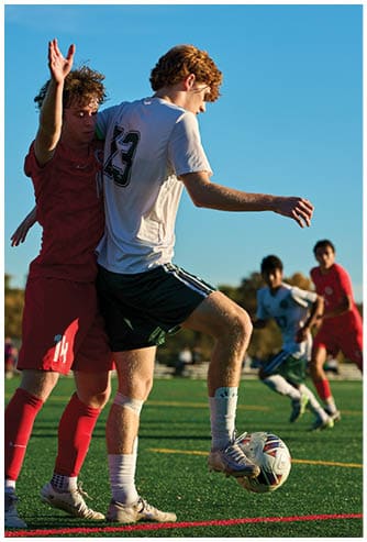 A football game is being played on a field. Description generated by AI