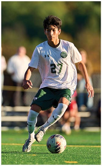 A football player catching a ball. Description generated by AI