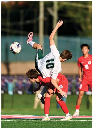A football player wearing a blue and red jersey. Description generated by AI