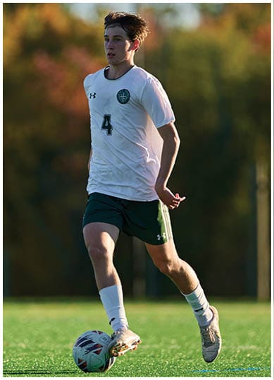 A football player wearing a blue and red jersey. Description generated by AI