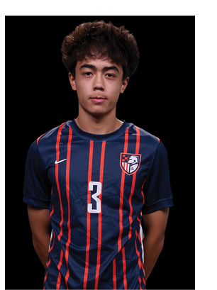 A young man wearing a white and black jersey with the number 14 on it. Description generated by AI