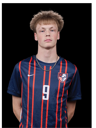 A young man wearing a white and black jersey with the number 14 on it. Description generated by AI