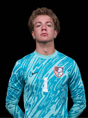 A young man wearing a white and black jersey with the number 14 on it. Description generated by AI