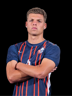 A young man wearing a white and black jersey with the number 14 on it. Description generated by AI