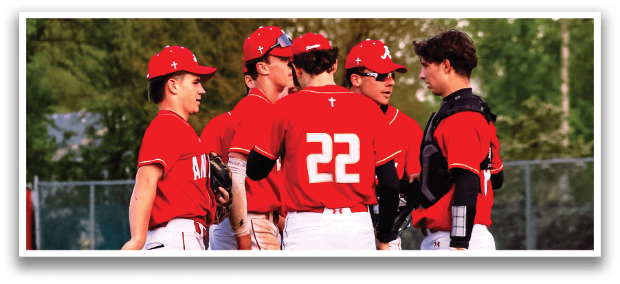 A group of baseball players wearing red and white uniforms. Description generated by AI