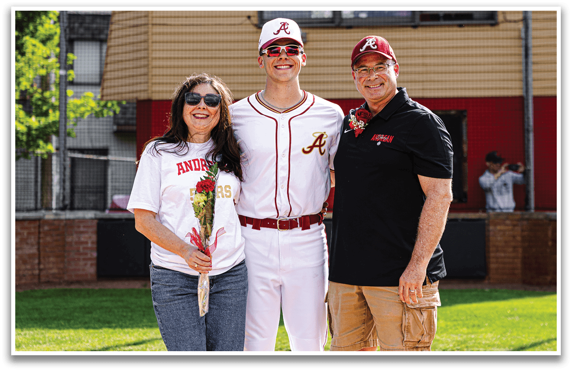 A man, woman, and boy are standing on a baseball field. Description generated by AI