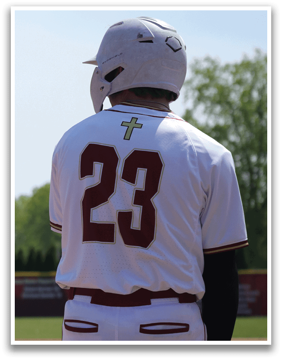 A baseball player wearing a white and red uniform. Description generated by AI