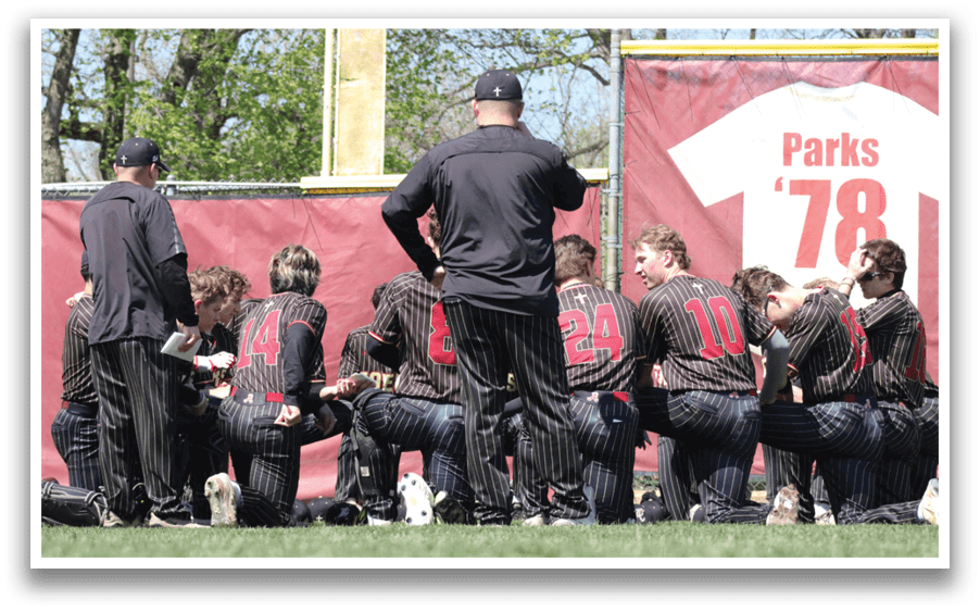 Baseball players in black and red uniforms. Description generated by AI