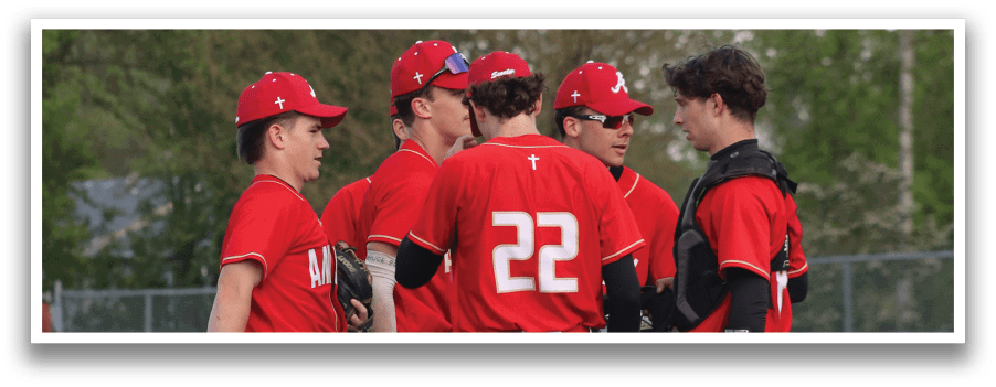 Baseball players wearing red and white uniforms. Description generated by AI