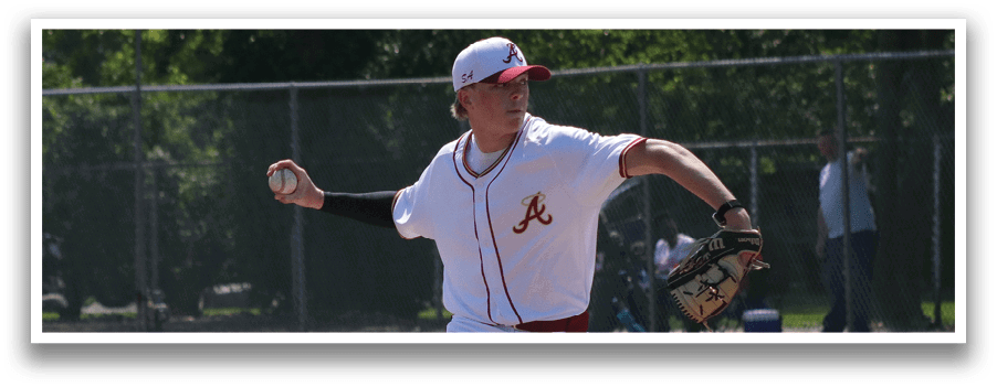 A baseball player in a red and white uniform is pitching a ball. Description generated by AI