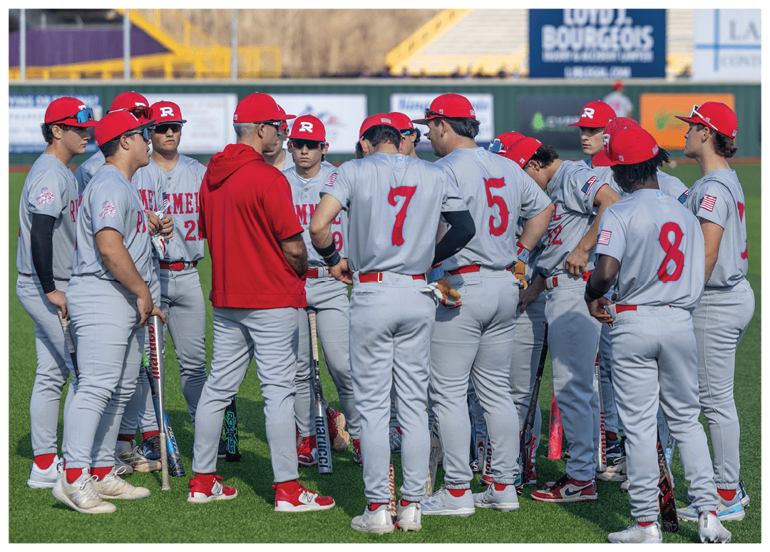 Baseball players wearing red and grey uniforms. Description generated by AI
