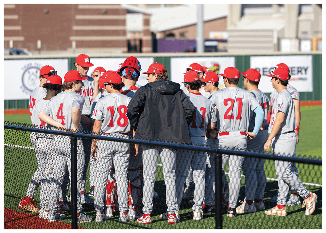 A group of baseball players wearing red hats and grey uniforms are standing on a baseball field. AI generated content