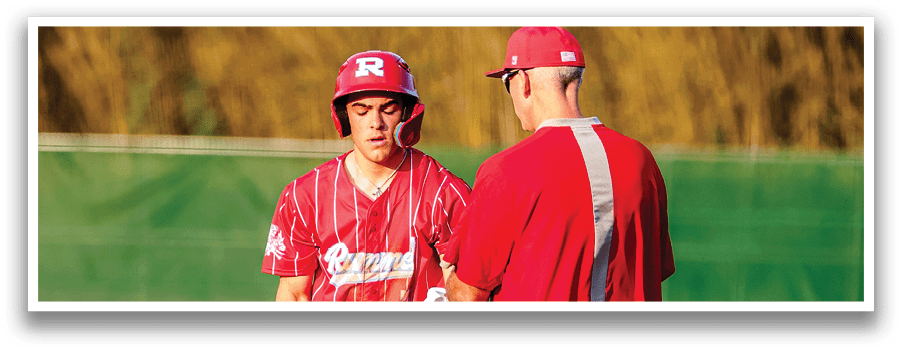 Two baseball players on a field. Description generated by AI
