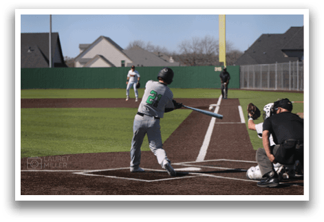 A baseball player is swinging a bat at a ball. AI generated content