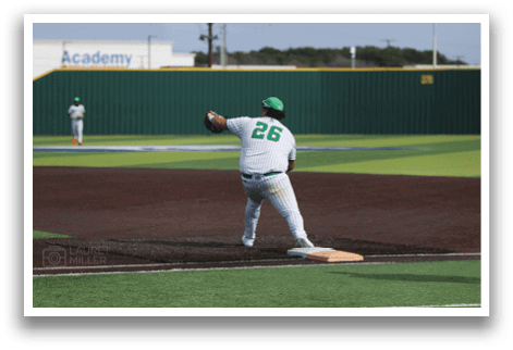 A baseball player in a green and white uniform is throwing a ball on a baseball field. AI generated content