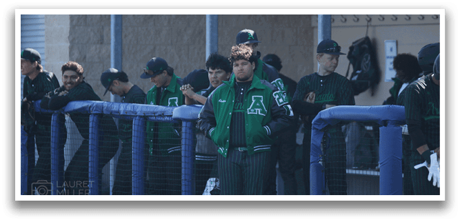 A group of baseball players wearing green and white uniforms are standing in a dugout. AI generated content