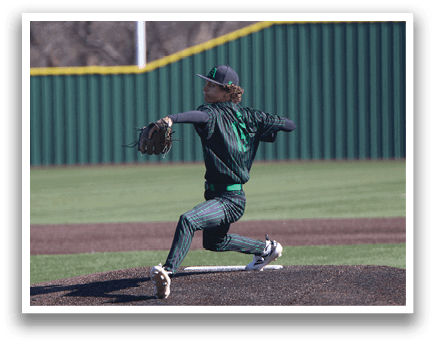 A baseball player in a green and black uniform is pitching a ball on a field. AI generated content