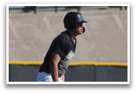 A baseball player wearing a black helmet and a grey shirt is standing on the field. AI generated content