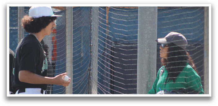 A man and a woman are standing next to a fence. The woman is holding a baseball glove. AI generated content