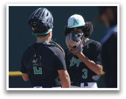 Two baseball players wearing black uniforms are talking to each other on the field. AI generated content