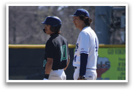 Two baseball players wearing black and white uniforms are standing on a field. AI generated content