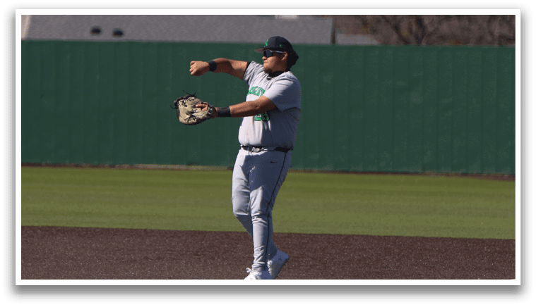 A baseball player in a grey uniform is pitching a ball on a field. AI generated content