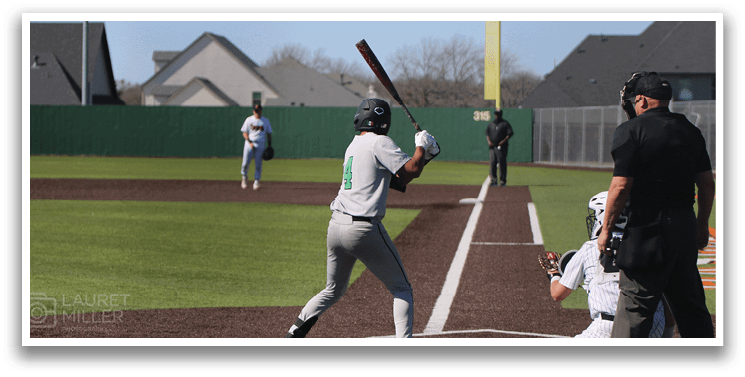 A baseball player is swinging a bat at a ball during a game. AI generated content