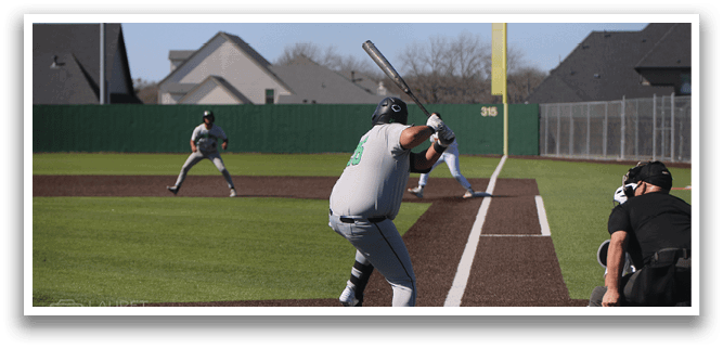 A baseball player is swinging a bat at a ball during a game. AI generated content