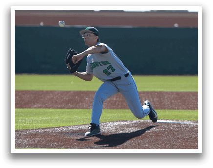 A baseball player in a green shirt and blue pants is pitching a ball on a field. AI generated content