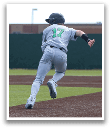 A baseball player is running to a base, wearing a grey uniform. AI generated content