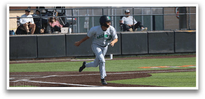 A baseball player is running towards home plate, wearing a grey uniform. AI generated content
