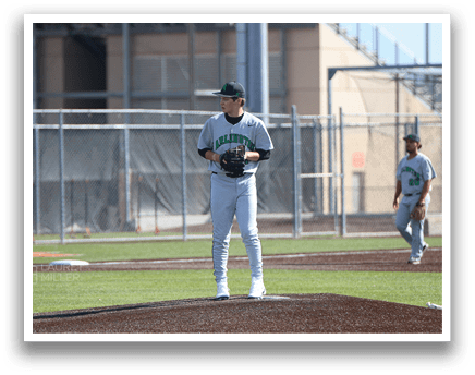 A baseball player in a grey uniform stands on the pitcher's mound, holding a baseball glove. AI generated content