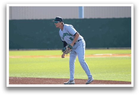 A baseball player in a grey uniform is standing on the field, holding a baseball glove. AI generated content