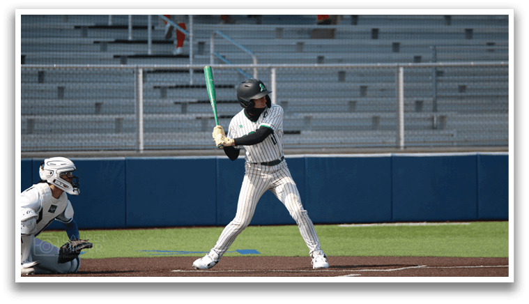 A baseball player is at bat, holding a bat and preparing to swing. AI generated content