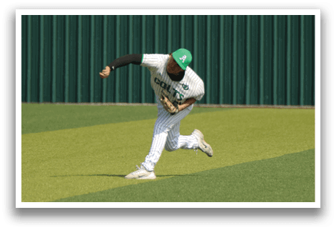 A baseball player in a white uniform is throwing a ball on a field. Another player is running towards the ball. AI generated content