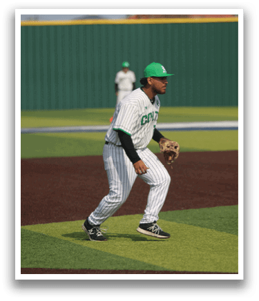 A baseball player wearing a green hat and white uniform is standing on the field. AI generated content