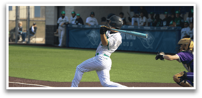 A baseball player is swinging a bat at a ball during a game. AI generated content