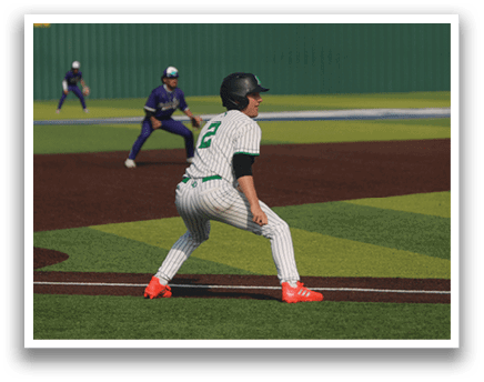 A baseball player in a green and white uniform is running to first base. AI generated content