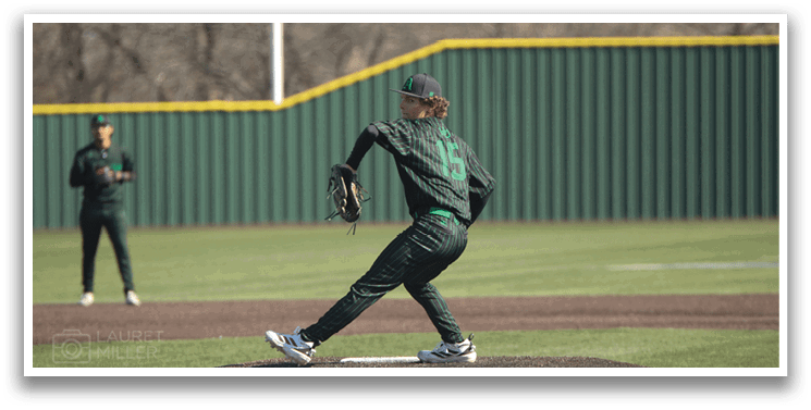 A baseball player in a green and black uniform is pitching a ball on a field. AI generated content