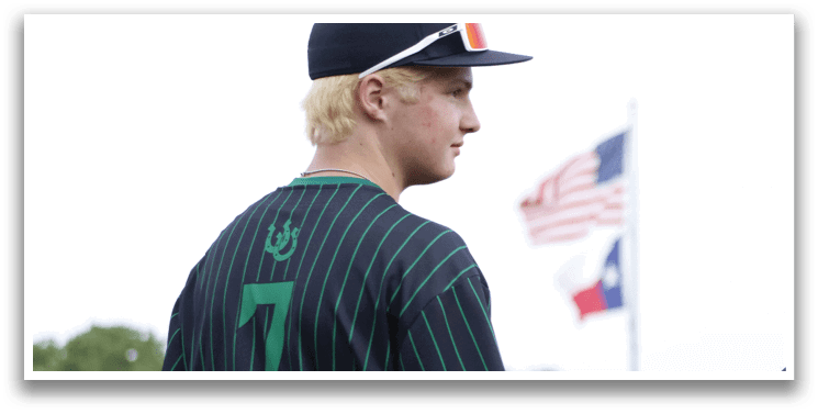 A man wearing a baseball uniform with the number 7 on the back. Description generated by AI