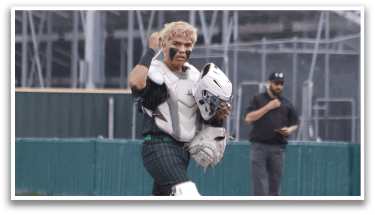 A baseball player in a white uniform running towards a base. Description generated by AI