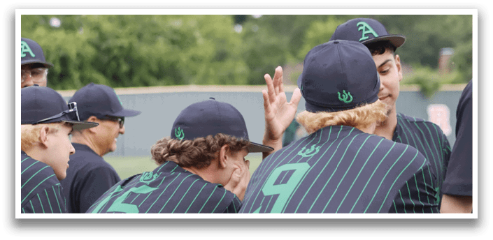 A group of baseball players wearing green and black uniforms. Description generated by AI