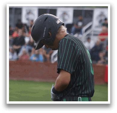 A baseball player wearing a helmet and holding a bat. Description generated by AI
